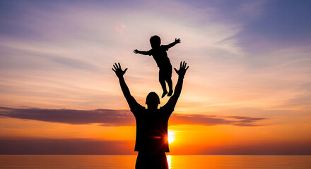 Fototapeta premium Silhouette of father and child raising hands at sunset on beach with warm glow