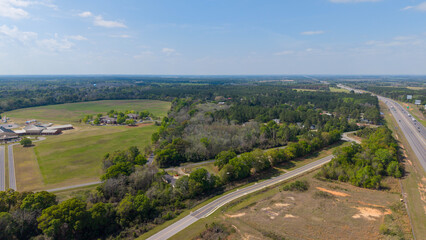 Fototapeta premium Aerial shot of cars driving on the highway in Ashburn Georgia USA