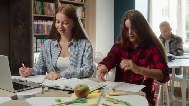 Caucasian teenagers students tired girl falling asleep during boring lesson in classroom sleepy exhausted from studying academic fatigue yawning at desk education overload schoolgirls indoors school