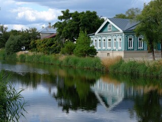 Obraz premium Serene house by calm lake reflection.
