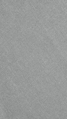 Fototapeta premium Gray textured fabric background, featuring a subtle woven pattern. The gray background adds a soft, elegant touch to designs. Gray textured mobile phone wallpaper with copy space.