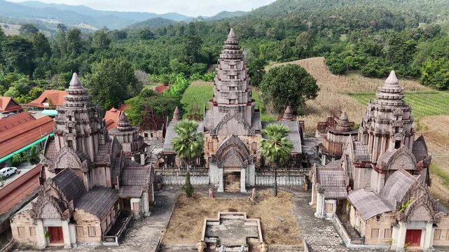 Slow aerial approach to Angkor Wat replica ruins at Mae Kachan Hot Springs.