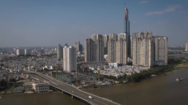 Expansive aerial view of modern ho chi minh city with its developing skyline and the saigon river