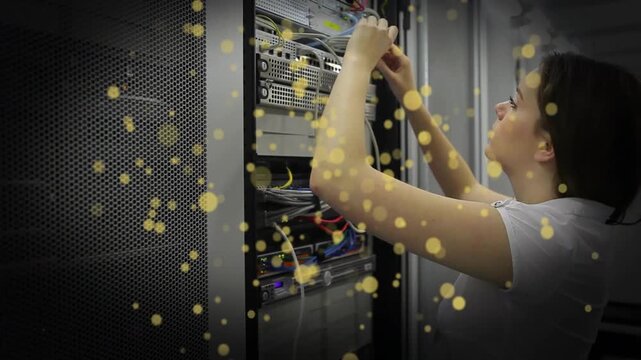 Reaching into rack, tech connecting network and power cables, tidying cables for network setup