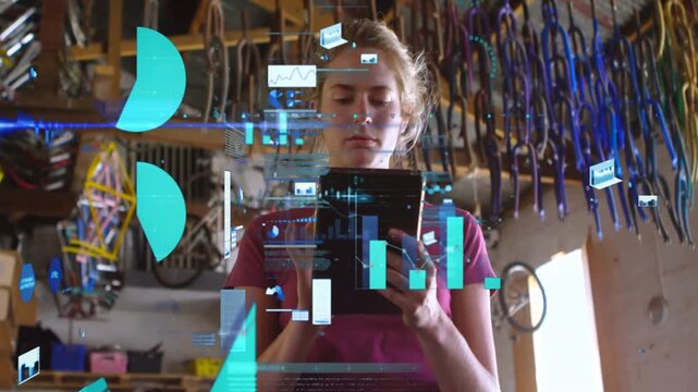 Female bike mechanic tapping tablet in workshop, causing AR charts forming layered repair data