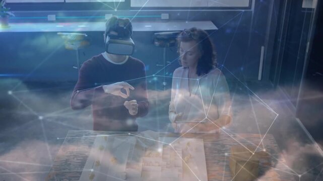 VR user pinching and swiping over table plan starting cloud overlay for design while guide watching