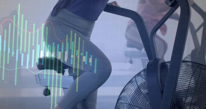 Woman pedaling fan bike in gym, camera pulling back revealing metric overlays tracking stats
