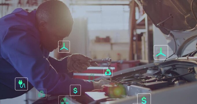 Ratcheting tech in blue coverall fixing battery clamp in garage as green icons rising, copy space