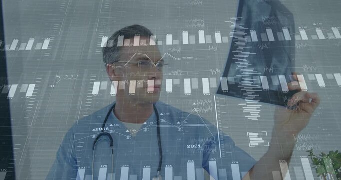 Mature male doctor picking radiograph triggers HUD overlay, rotating film and correlating charts