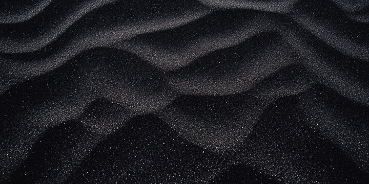 Background with black sand and white specks