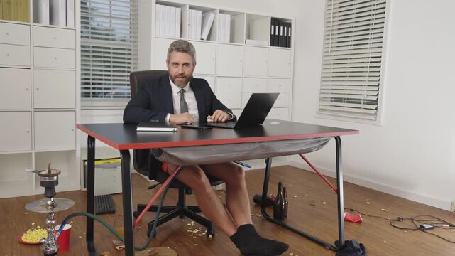 Crazy freelancer. A businessman in jacket and shorts on funny business meeting. Fun freelancer. Crazy business man freelancer on business meeting in mess. Funny workday. Free freelancer.