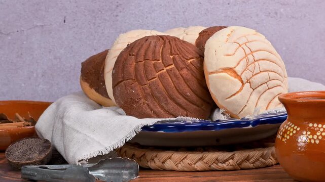 Authentic Mexican pastry conchas on handcrafted ceramic plate