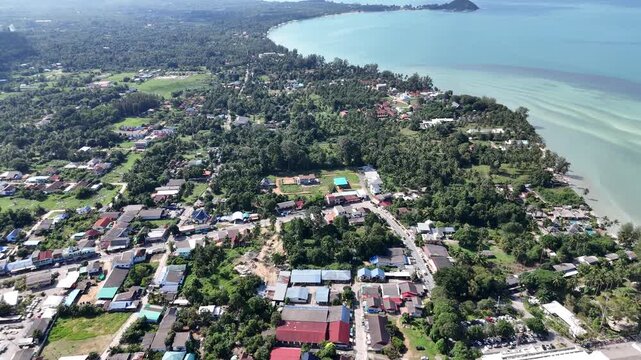 Cinematic 4K aerial 360-degree panorama of Koh Samui, Thailand: from tropical coastline and piers to lush mountain jungle and town.