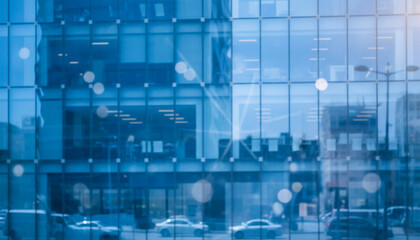 Fototapeta premium Blurred glass wall of modern business office building at the business center use for background in business concept. Blur corporate business office. Abstract windows with a blue tint