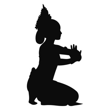 Silhouette of Traditional Thai Dancer in Elegant Kneeling Pose with Headdress