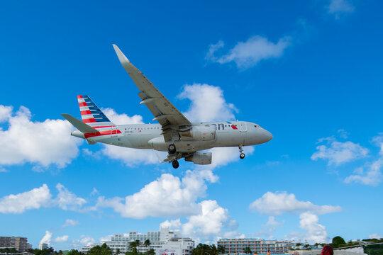 American Airlines Airbus 319-100 N9026C flying over Maho Beach before landing on Princess Juliana International Airport SXM on Sint Maarten, Dutch Caribbean. 