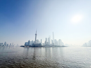 Fototapeta premium Pudong Skyline from Huangpu River with Bright Hazy Sun