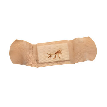 A used adhesive bandage with a small blood stain on the center pad showing signs of wear.