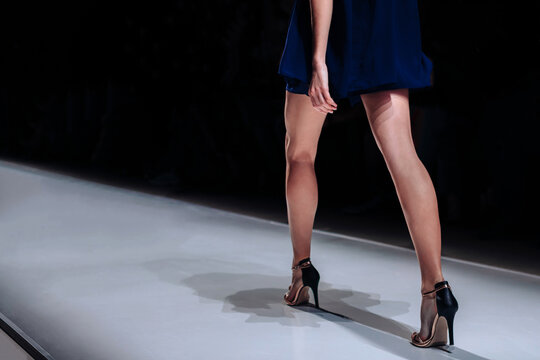 Elegant women fashion cloth, short blue dress and high heels , chic clothes outfit. Fashion model walking the runway fashion show