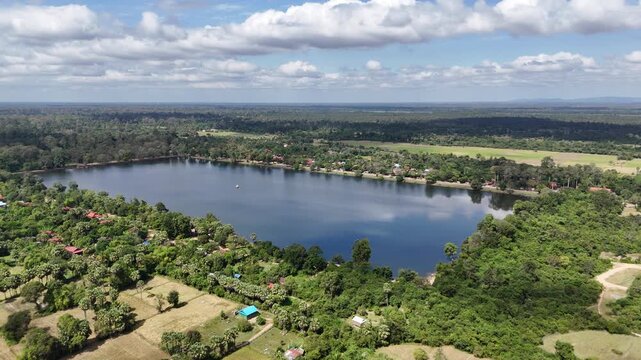 Drone footage of historical royal reservoir Srah Srang with lush tropical jungle at Angkor Archaeological Park, Cambodia. 