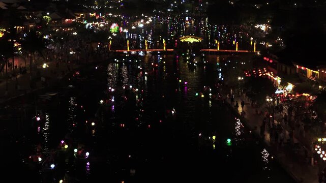 Drone view of Hoi An riverside at night (1of2)