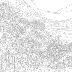 Fototapeta premium A coral reef with sea fans and fish swimming in the water