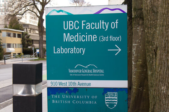 UBC Faculty of Medicine and Laboratory directional sign at Vancouver General Hospital, 910 West 10th Avenue, with University of British Columbia crest