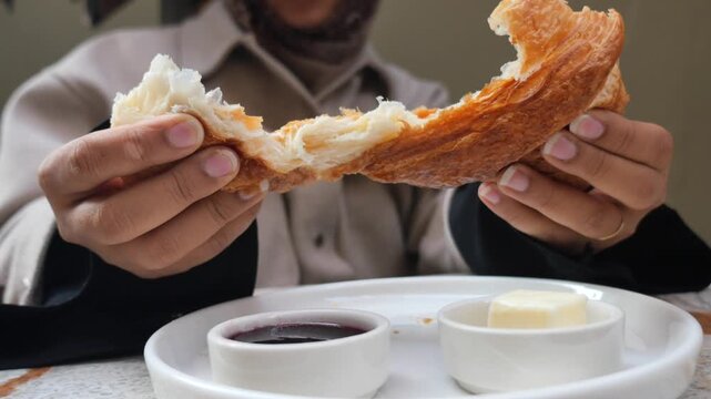 Morning croissant and jam at a cafe in Paris