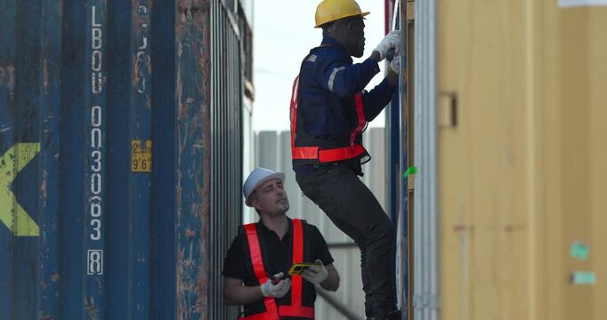 Two container yard technicians inspect shipping container doors, supporting preventive maintenance, safety compliance, damage assessment, cost control, and reliable freight operations.
