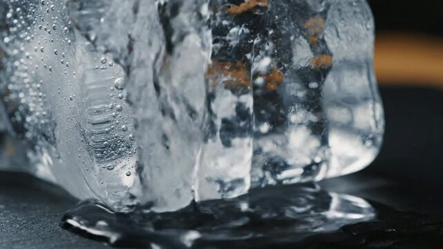 Ice Block Melting Slowly With Bubbles Forming Clear Water Drops Splash