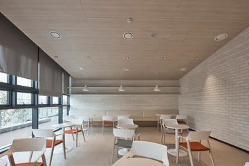 Fotobehang Horeca Minimal cafe or lounge seating area with light wood finishes  © Namsun