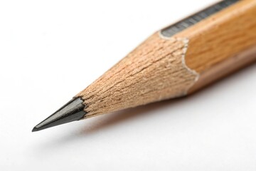 Fototapeta premium A pencil with a black tip is shown on a white background
