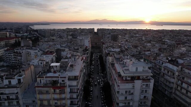 Stunning aerial cityscape of thessaloniki, greece revealing the rotunda monument at sunrise
