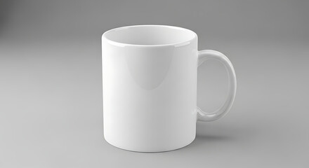 Obraz premium A plain white ceramic mug isolated on a neutral grey background, ready for customization.