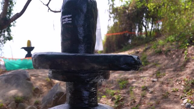Big Shivling near beach in Karwar Karnataka.Shiva lingam surrounded by trees near coastline India.