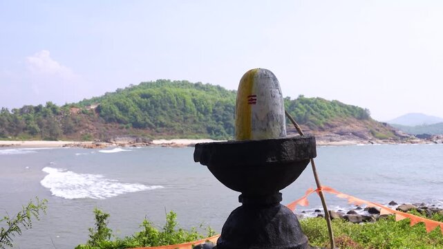 Big Shivling near beach in Karwar Karnataka.Shiva lingam surrounded by trees near coastline India.