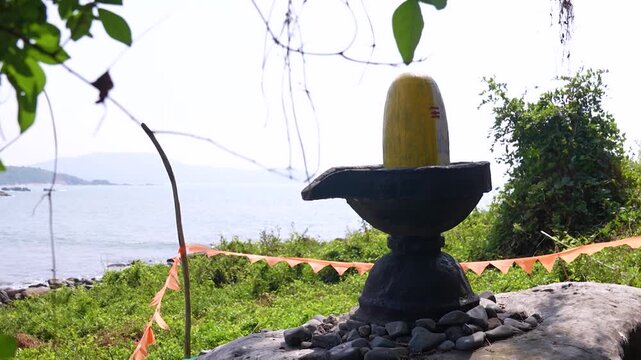 Big Shivling near beach in Karwar Karnataka.Shiva lingam surrounded by trees near coastline India.