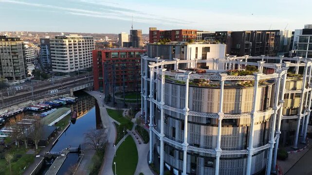 Aerial view of London Gas Holder Park and buildings construct inside decommissioned old gas holders