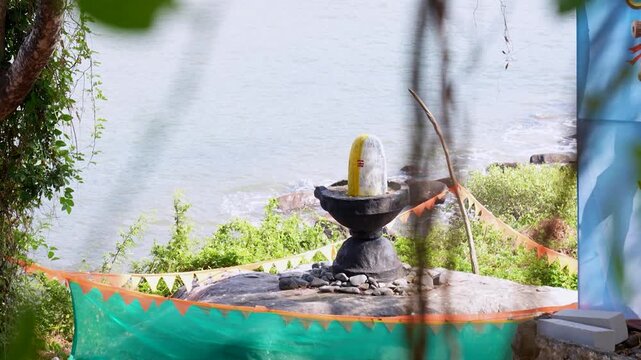 Big Shivling near beach in Karwar Karnataka.Shiva lingam surrounded by trees near coastline India.