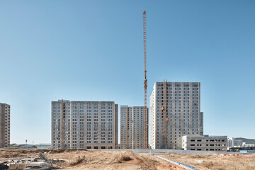 Residential towers and crane in emerging urban development area © Namsun