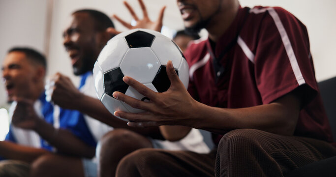 Hands, friends and celebration with football in home on couch, cheers and fist pump for goal in lounge. People, excited and group with watching tv, soccer game or global competition at apartment
