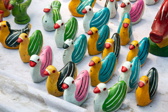 Colorful Handmade Clay Bird Toys on Display. Clay products in a traditional fair in Chittagong, Bangladesh, called Jobbarer Boli Khela.