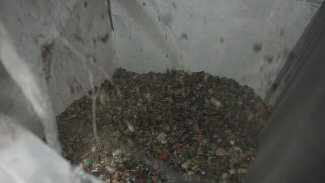 Industrial Plastic Fragment Collection. Indoor Recycling Plant With Plastic Debris And Conveyor Belt . Media