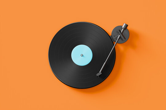 Vinyl record playing on turntable with orange background