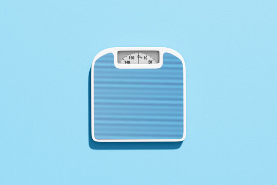 Blue bathroom weight scale on light background