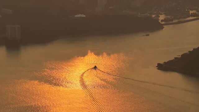 Rocky shoreline and village structures define scenic Lei Yue Mun Feb 22 2026