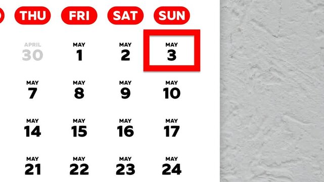 The date May 3rd marked with a red cursor on the wall calendar 2026