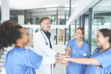 Fototapeta premium Doctor, nurses and stack hands for support in hospital, success and target for healthcare. Happy people, medical group and pile together for team building, solidarity and motivation for mission