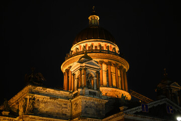 The façade of the majestic classical building of St. Isaac's Cathedral illuminated at night. Russia. St. Petersburg. © EVGENII