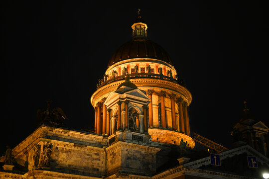 The fa&ccedil;ade of the majestic classical building of St. Isaac's Cathedral illuminated at night.
Russia. St. Petersburg.